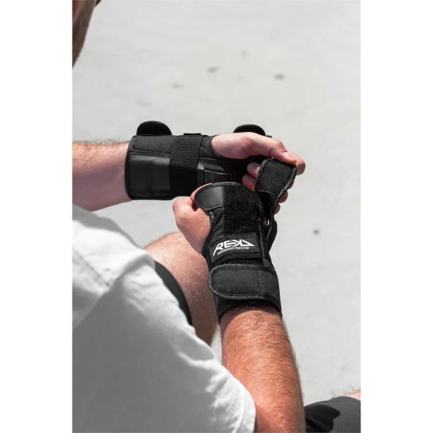 RKD490 REKD Wrist Guards Black Putting On 4.jpg